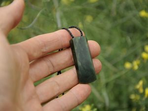 Chatoyant Inanga Pounamu Toki — A Carved Piece