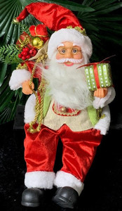 Products: Sitting Santa holding present approx 40cm tall