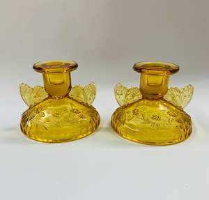 Pair of Amber Glass butterfly candlesticks