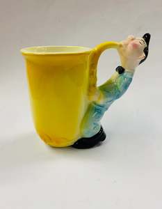 Cups And Saucers: Vintage novelty saxophone player mug