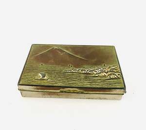 Kiwiana: Metal Tin or a Sea Scape (maybe Rangitoto Island with a sail boat)