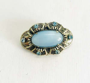 Brooches: Silver Metal Brooch with Blue Oval center