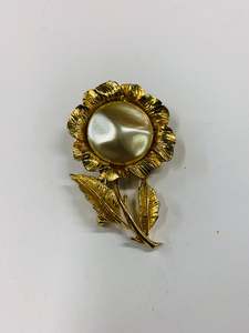 Gold tone flower brooch with faux Pearl centre