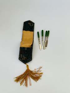 Antique manicure set in original fabric sleeve