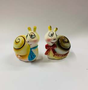 Pair of vintage novelty snail salt and pepper shakers
