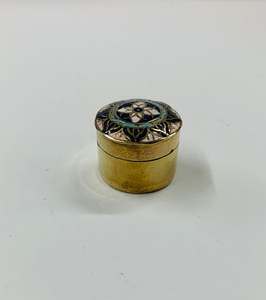 Brassware: Antique brass pill box with enamel design lid