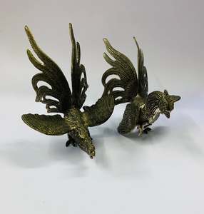 Pair of vintage metal fighting roosters