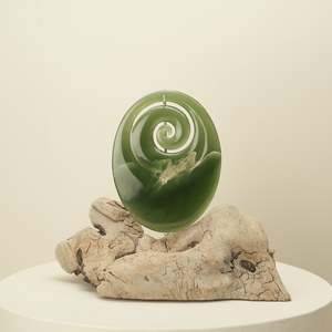 Koru Pounamu Sculpture on Wood Base