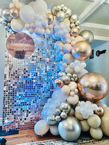 Rose gold shimmer wall with balloons