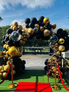 Corporate Balloon Packages: Black and gold organic arch