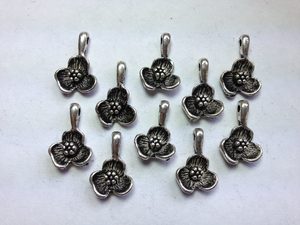 Products: 10 Silver metal flower charms Beadzone