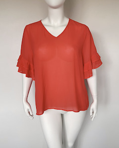 Gloss by Shine On orange top