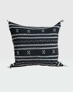 Black base and intricate white tribal-style patterns