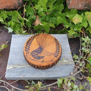 Products: Round Piwakawaka Box - Burnt Offerings