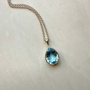 Sterling Silver Blue Topaz Pear Cut Rubover Pendant