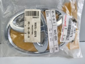 Toyota Parts Automated: Genuine Front Grill Badge Toyota Land Cruiser J100 FL 2005 - 2007 NEW