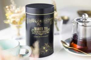 Unlabeled Large Signature Black & Gold Tin - Charity Tea