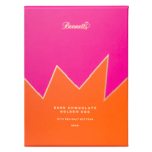 Dark chocolate egg with salted chocolate buttons inside boxed