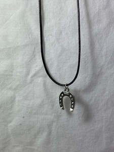 Jewelry And Accessories: Black rope necklace with horse shoe