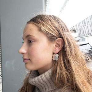 5th Anniversary Wood And Silverware: Flying Dog Earrings | Crossroads