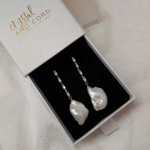 Stylish Classics: Isla - cubic zirconia's embellished and natural cultured freshwater pearls cascading earrings