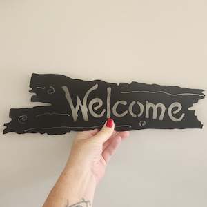 Powder Coated: welcome log