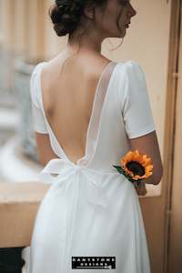 Mermaid Wedding Dresses: Elegant Backless Wedding Dress with Bow Accent and Short Sleeves