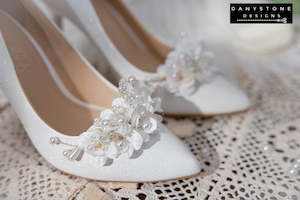 Elegant White Metallic Leather Wedding Heels with Floral Embellishments