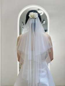 Veils: Chic Tiered Veil with Floral Hairpiece Accent
