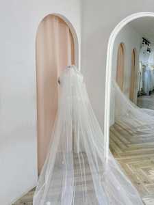 Ethereal Chapel-Length Veil with Delicate Floral Embellishments