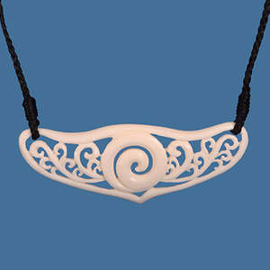 Maori Bone Carvings: Intricate Koru breastplate necklace