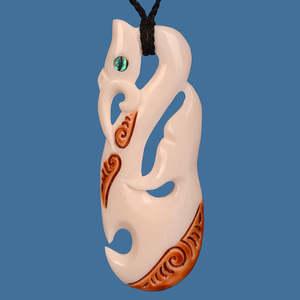 Maori Bone Carvings: Bone Manaia with Whale Tail and Stain Pendant