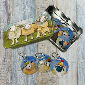 Happy Sheep stitch markers in a pocket tin