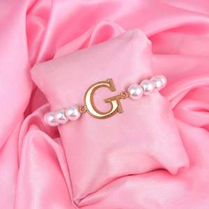 Bracelet: Estele Rose Gold Plated Glowing "G" Letter Glass Pearl Bracelet for Women