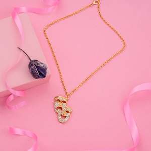 Pendant: Estele Gold tone chaing with laughing and sad masks with white stones for women