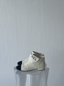 Chaenl: CHANEL Lambskin Grosgrain Fold Over Logo Cap Toe Boots 38