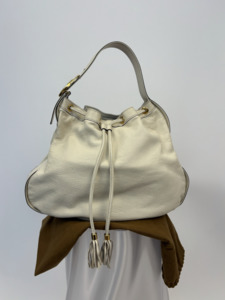 1000 1999: Gucci Interlocking Icon Tassel Hobo in Cream Leather