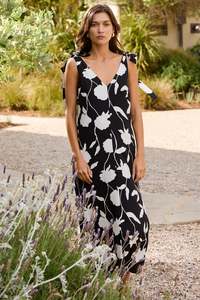 Autumn Tones: Spontaneous Black and White Floral Tie Shoulder Relaxed Midi Dress