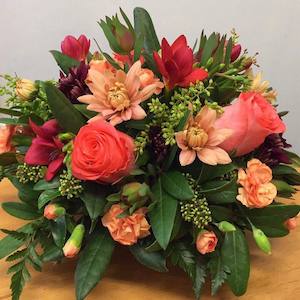 arrangement: Posy bowl Arrangement in bright colours.