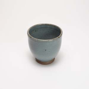 Footed cup by Driving Creek Pottery made in the Coromandel, Aotearoa, two colours