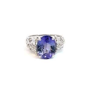 Engagement Rings: Oval Tanzanite set in 9ct White Gold with Flower Design