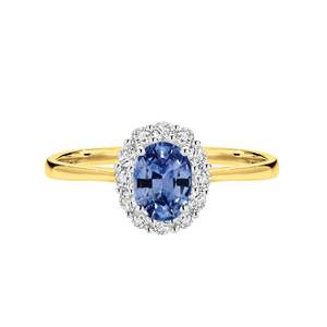 Jewellery Sapphire: 18ct yellow and white gold ring featuring a 7x5mm oval cut Ceylon Sapphire with a halo of Diamonds.