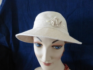 Products: L605 small brim seagrass linen, very suitable for smaller heads, tiny flower and bead trim $68 Hokianga Hats