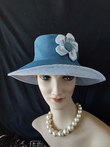 R257: Lightweight denim hat with blue strip reverse and 5 petal flower trim Hokianga Hats