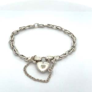 Wrist: Sterling Silver Bud Wire Bracelet with Heart Locket