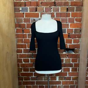 Products: GANNI ribbed top