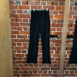 Products: ANNIE BING pleated pants