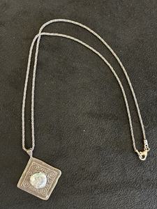 Engraved scroll pendant