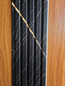 Flooring: WPC Slat Wall Panel Black and Gold