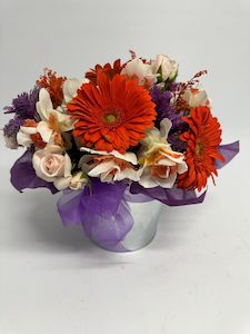Products: Seasonal Flowers Orange Delivered In A Tin - Jan Maree Flowers